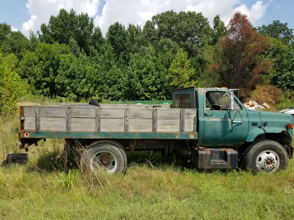 Notice of Sale: 1986 C64 Chevrolet Flatbed Dump Truck
